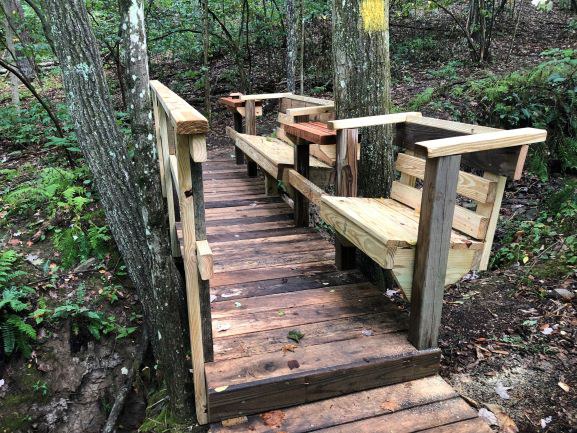 Mark added seating to his footbridge project to create a quiet, comfortable place to enjoy the view.
