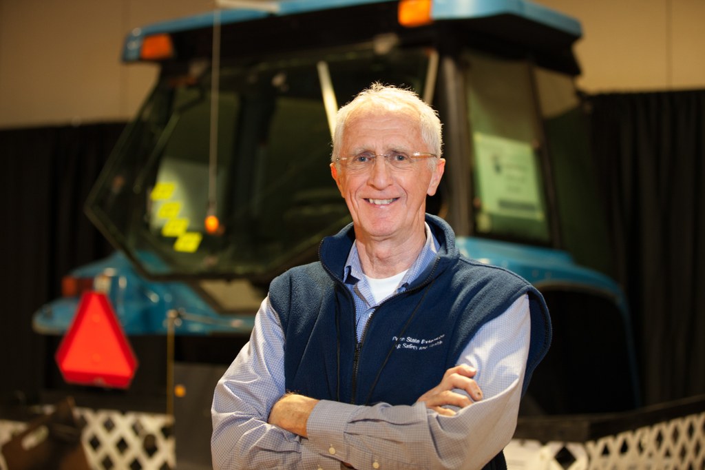 Bill Harshman waiting to show guests the potential hazards of a  tractor. 