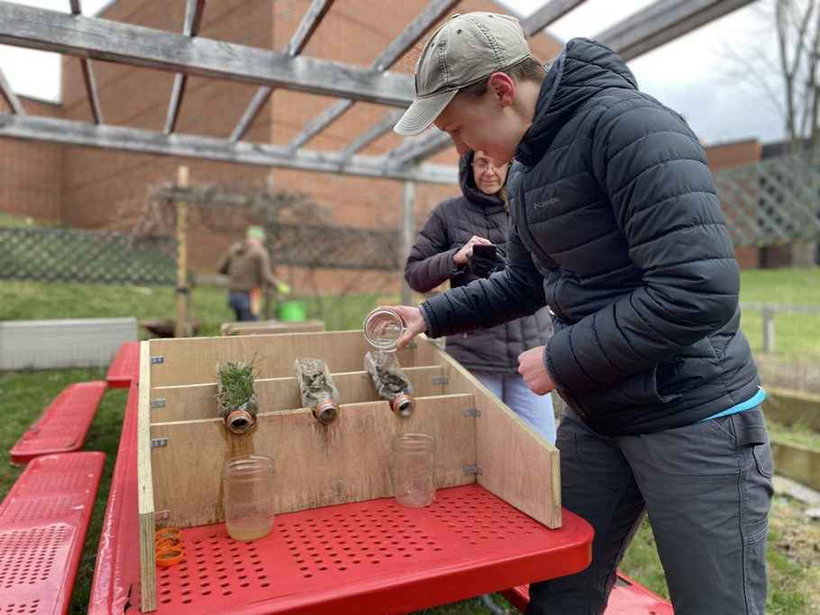 We seek out opportunities to share our research findings and engage our local community through outreach events. Ph.D. student Madeline Luthard (right) and Postdoctoral Researcher Kathleen Arrington (left) share a hands-on demonstration with an elementary school community garden to illustrate the ability of plants to mitigate erosion. Photo taken by Dr. Christina Grozinger.