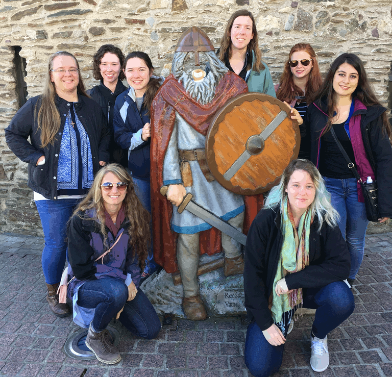The class in Waterford, Ireland. standing, L-R: Caitlin Rauch, Anne McGraw, Kylie Hint, Melissa Miller, Hanna Albright, and Nicole Rella. Kneeling (L) chaperone Mara Cloutier and (R) student Bethany Thatcher. Dr. Drohan took the picture.